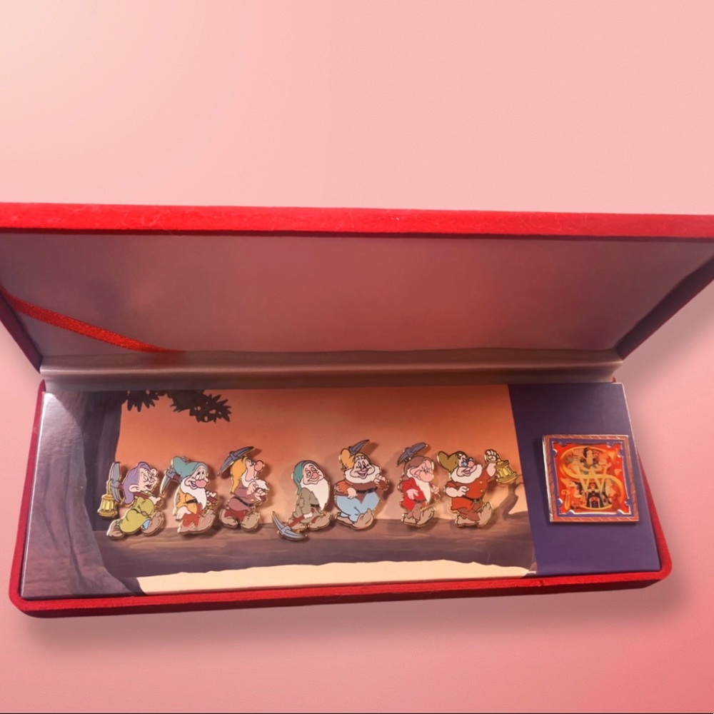 Seven dwarves from Snow White pin set. Very hard to find.